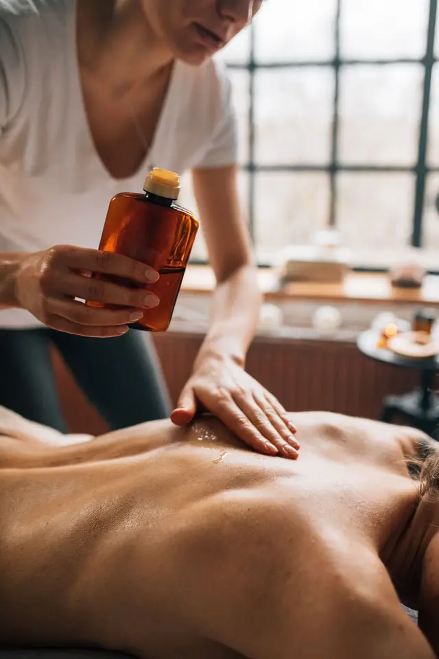 Warm oil massage in progress